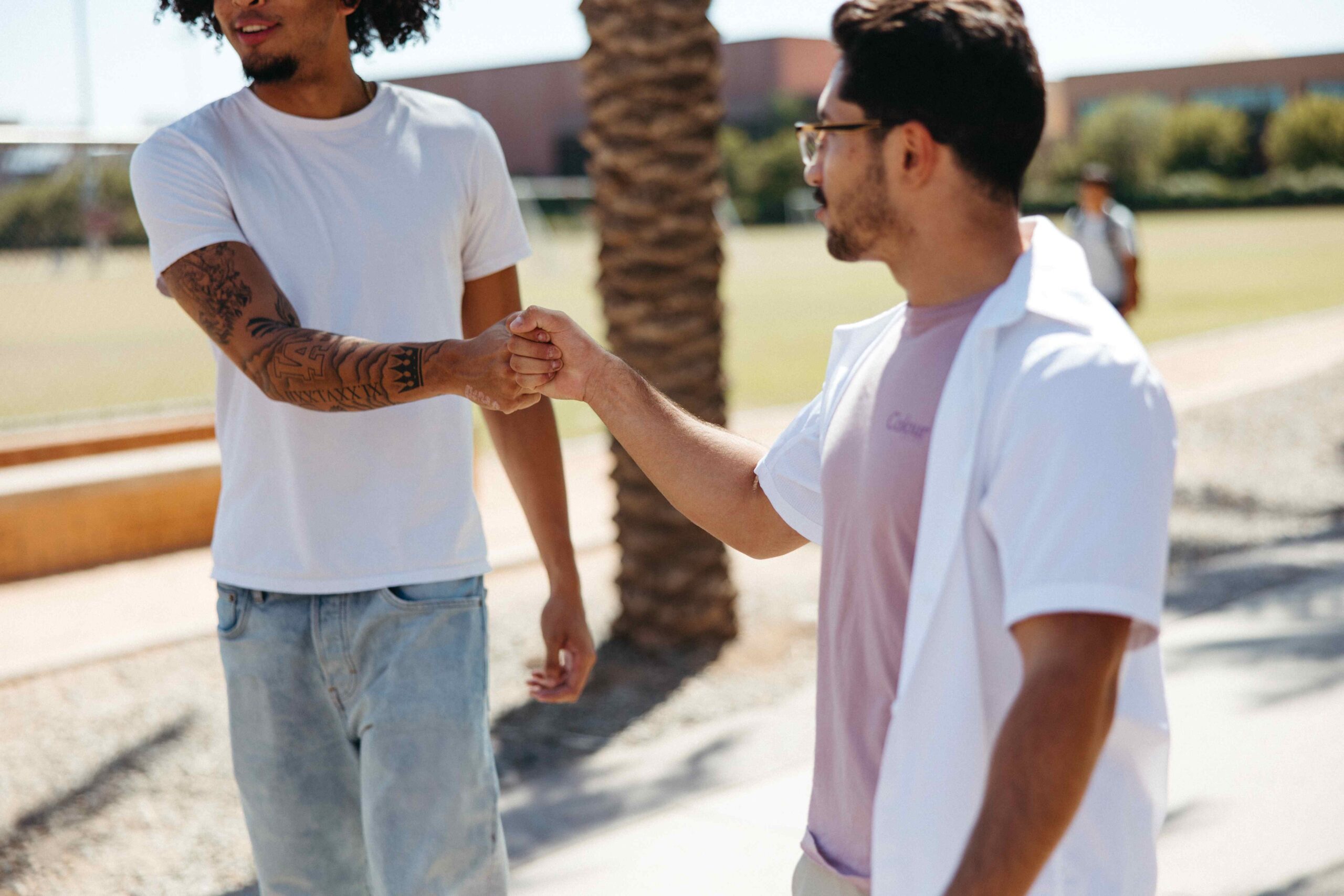 Two students at ASU shaking hands