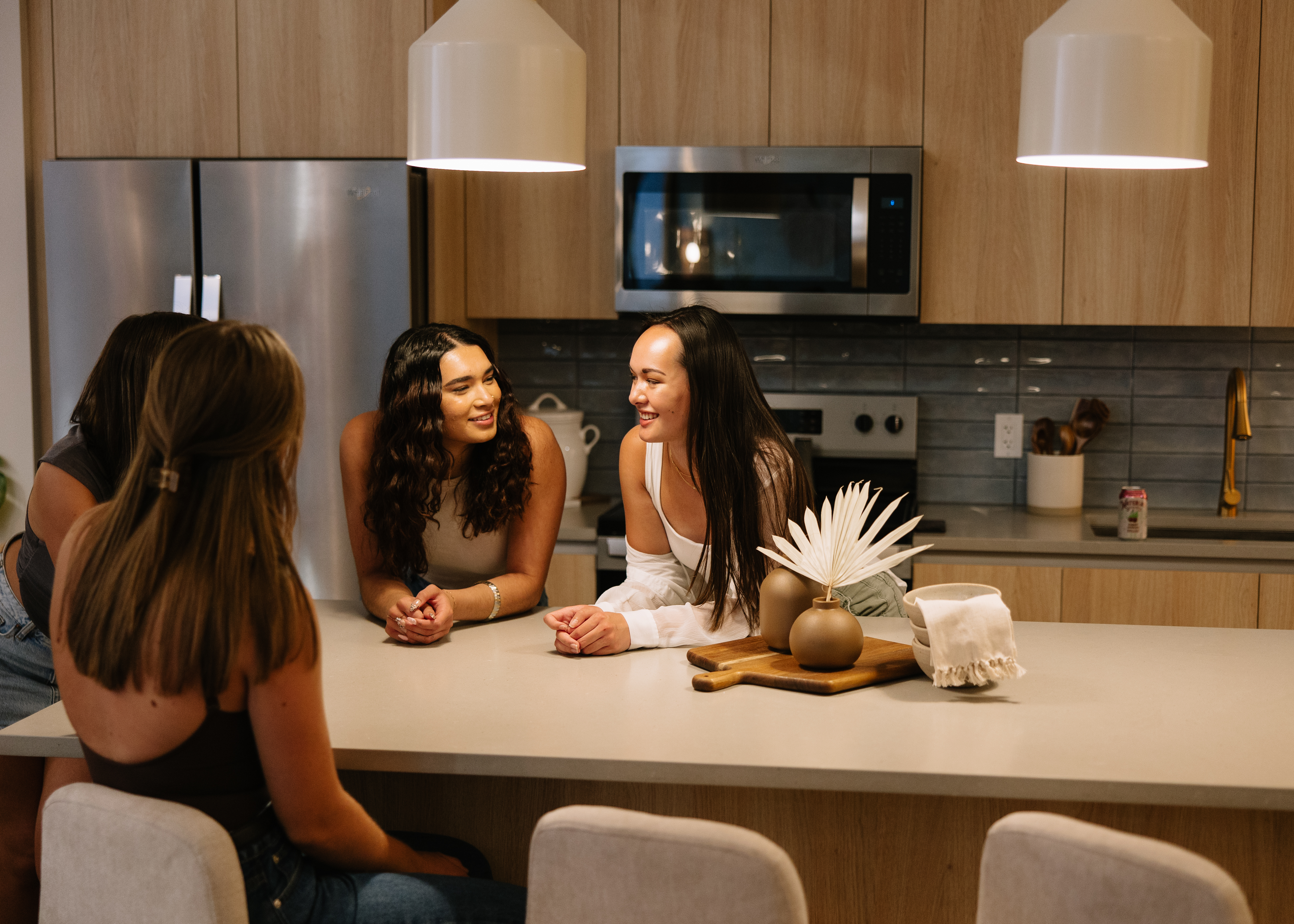 Roommates talking in their kitchen