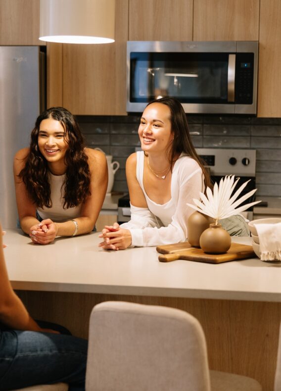 Roommates talking in the kitchen