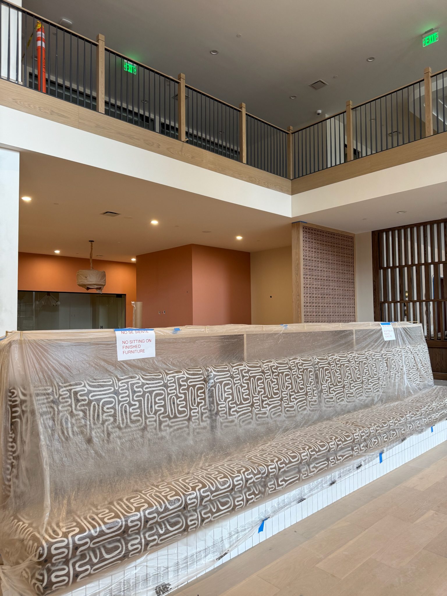 Permanent banquette seating arriving in the lobby, just waiting to be unwrapped.