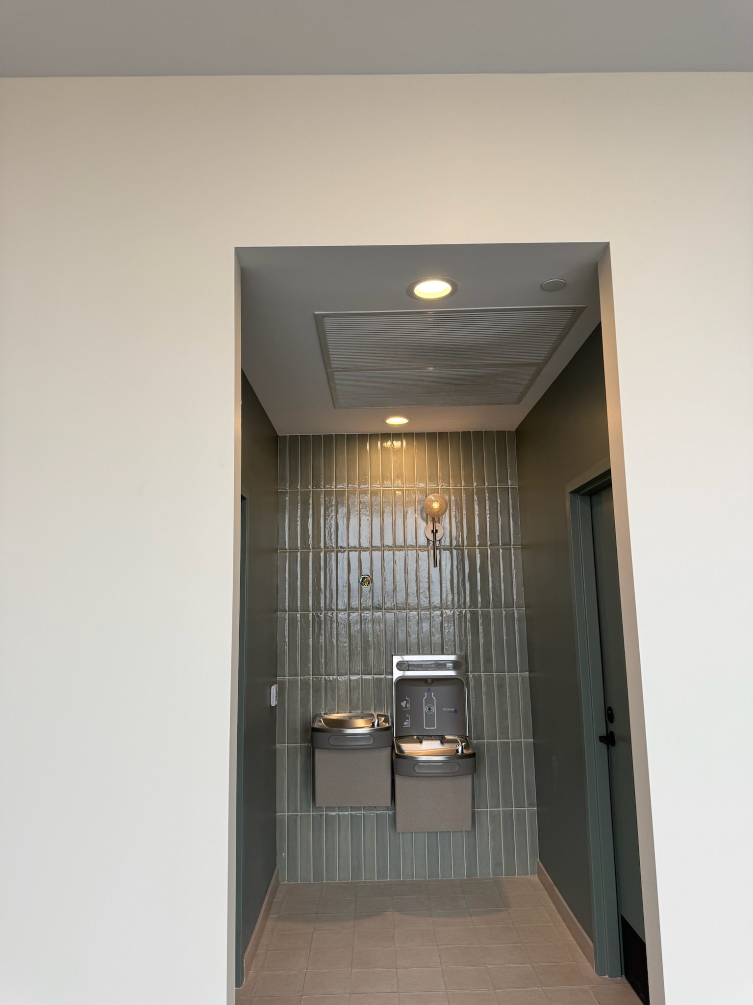 Water fountains with beautiful surrounding tile installed throughout the amenity spaces.