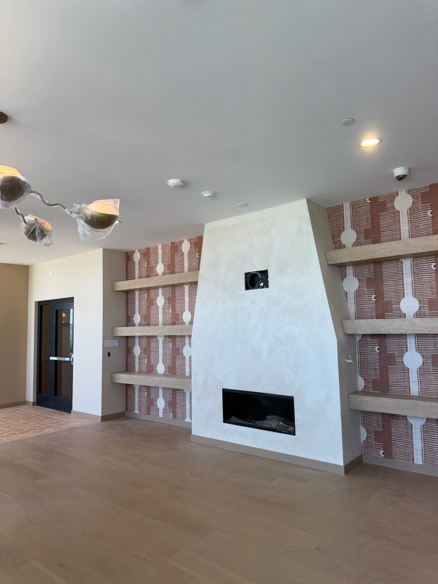 The clubroom fireplace, flooring and cabinets all in place.